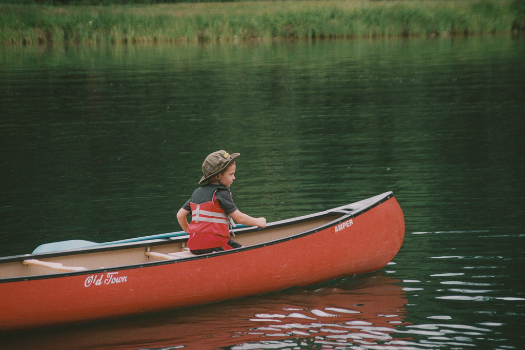 Confident child canoeing