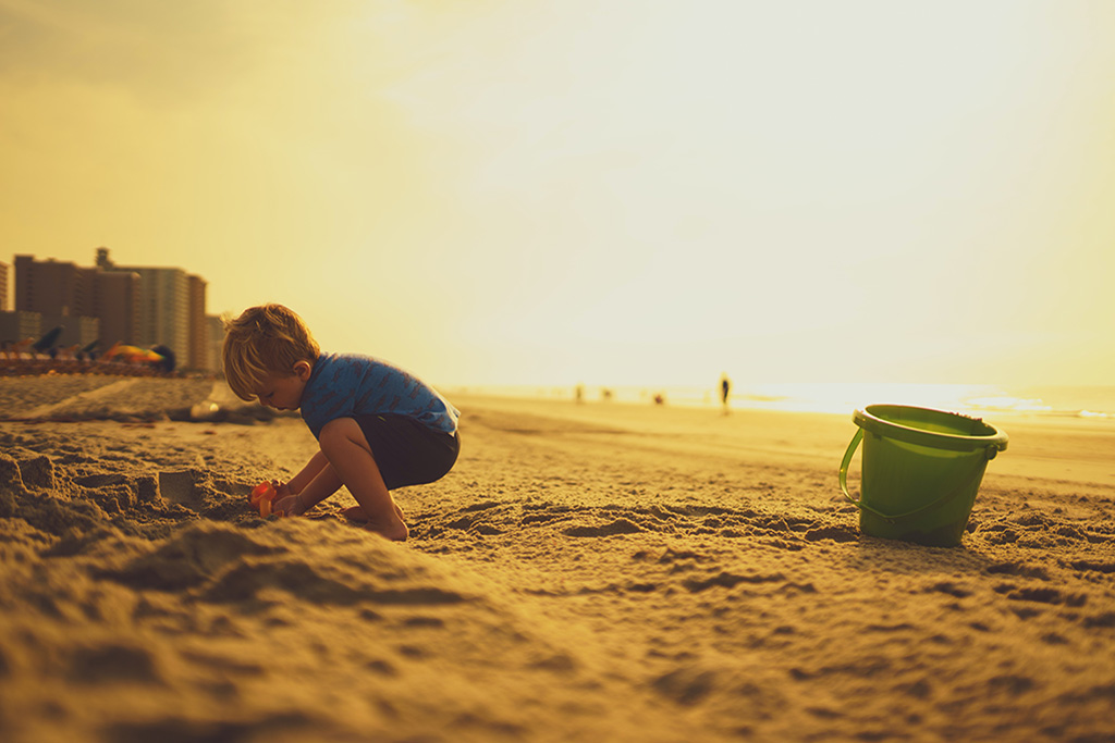 A child playing in on the beach